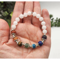 Lucky Chakra white beaded stretchable gemstone bracelet with silver charms 7.5