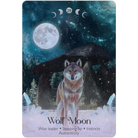 Wolf moon card from lunar magic oracle deck featuring a detailed gray and brown wolf by stone structure under full moon