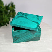 Teal malachite 2-inch square box BC0625 with glossy swirling pattern and open lid