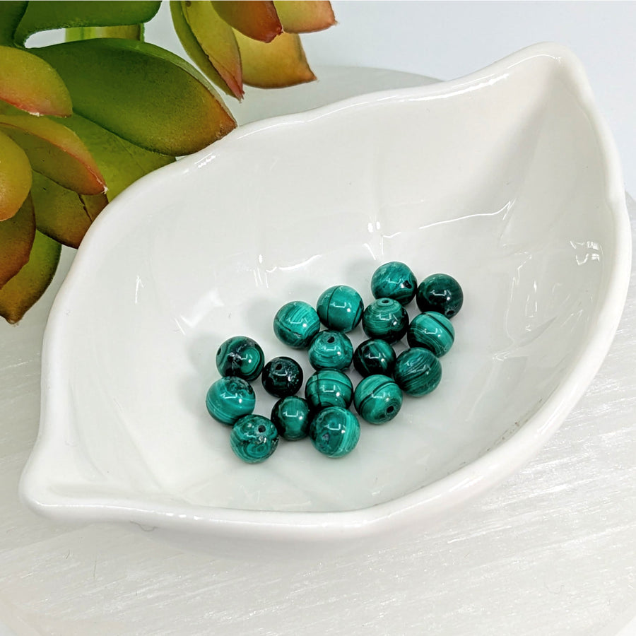 Green malachite beads for jewelry making in a pack of four, 6.5mm round shape