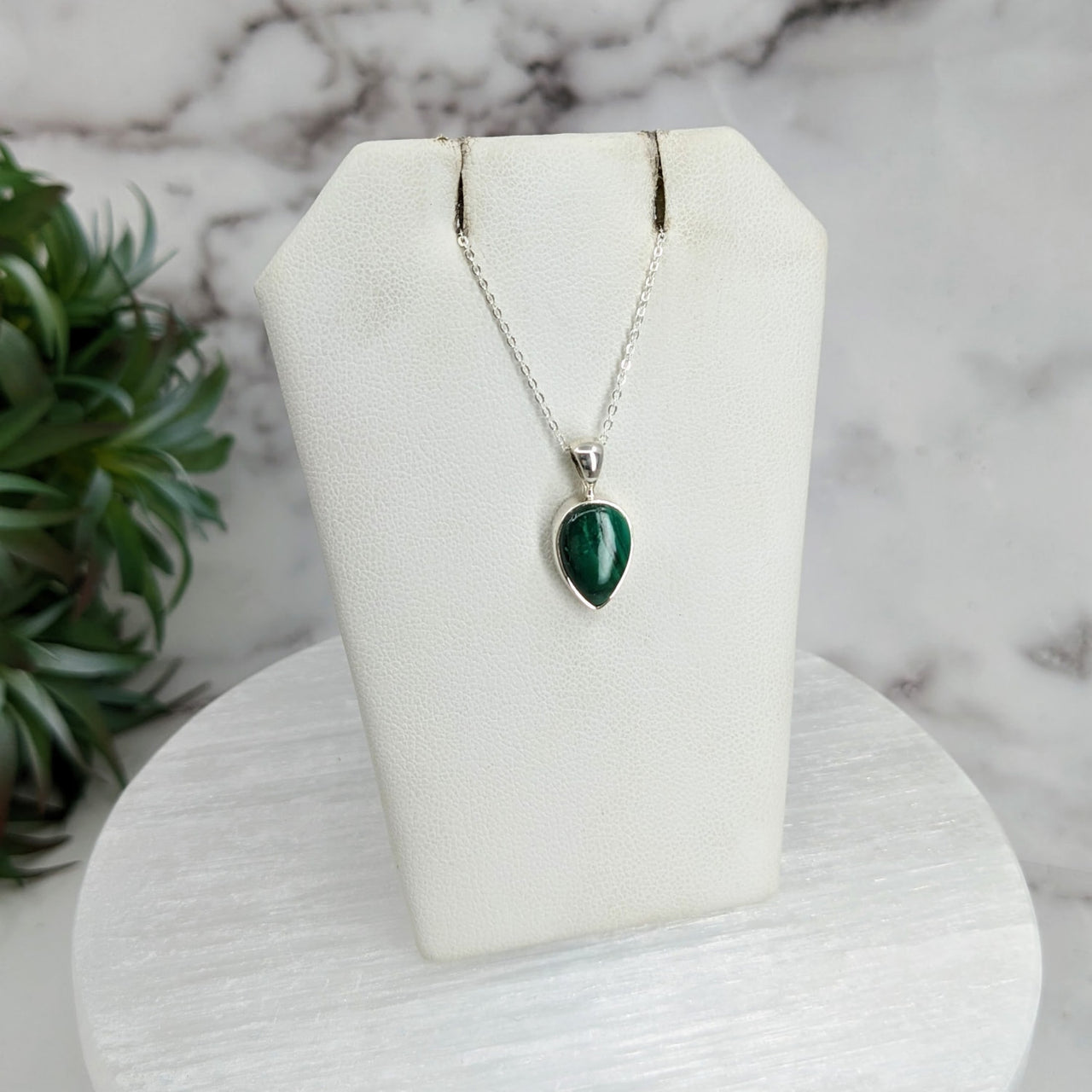 Close-up of Malachite Polished Necklace Sterling Silver Slider Pendant with plant