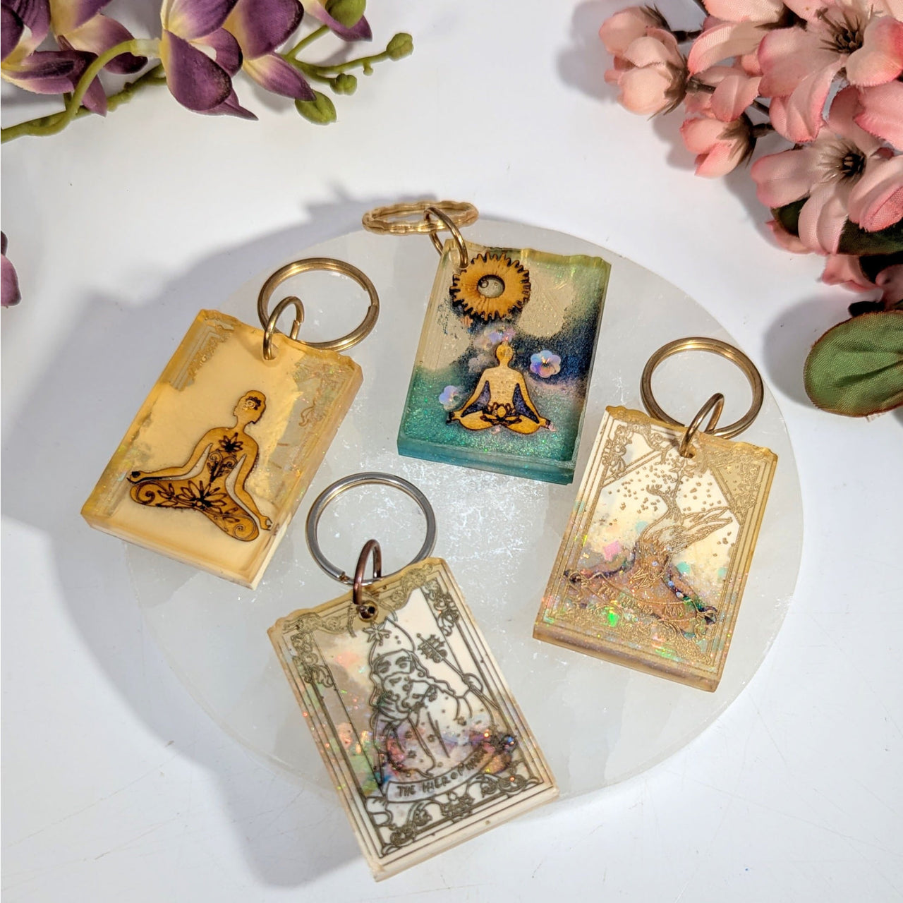 Meditation Tarot 3’’ resin keychain with meditative figures in amber resin