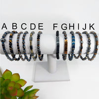 Assorted beaded bracelets featuring Hematite Onyx and Tigers Eye gemstones for men