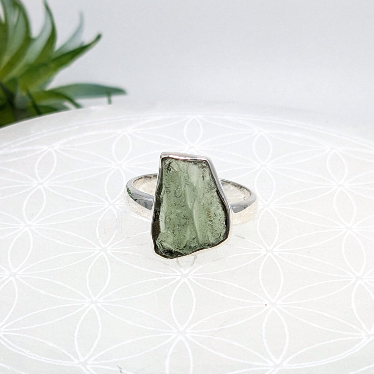 Silver moldavite ring with raw green crystal, perfect for unique jewelry lovers