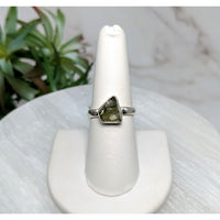 Silver ring with green Moldavite stone in size 7.5 displayed on product Moldavite Sz. 7.5 S.S. Ring #LV5518