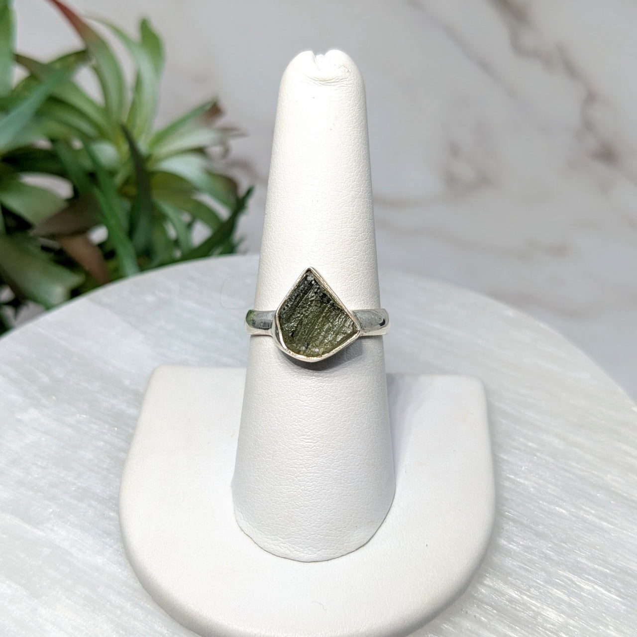 Silver ring with green Moldavite stone in size 7.75 displayed in product LV5519