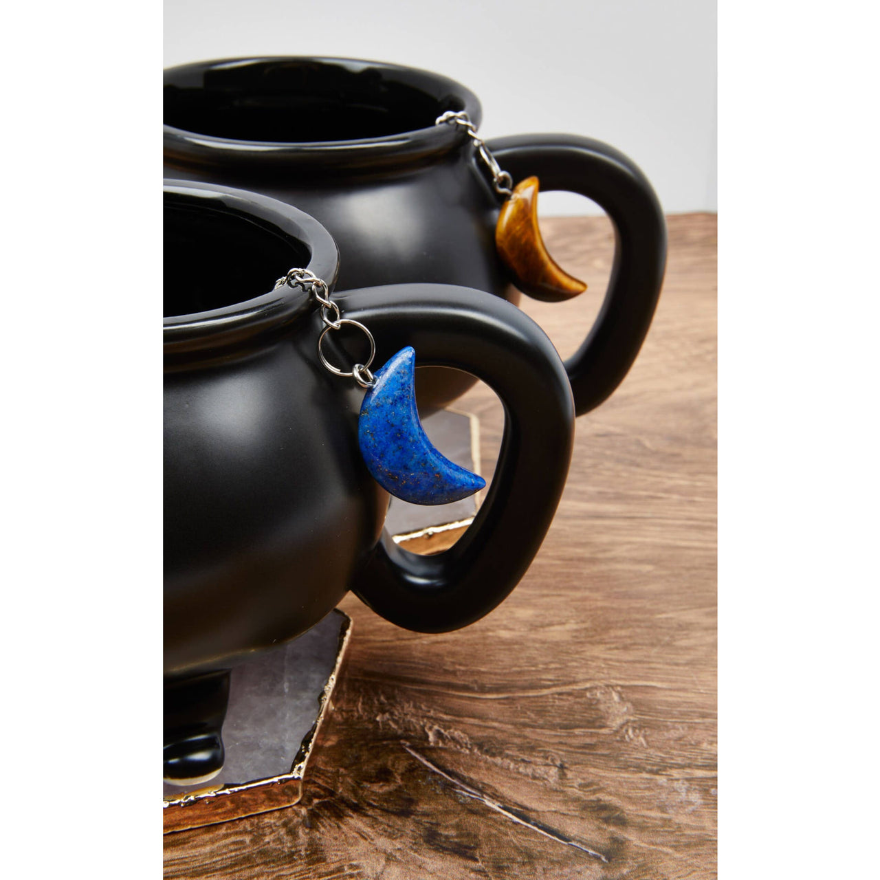 Two black tea cups with a blue moon from Moon Crystal Tea Infuser - Tea Strainer #LV5490