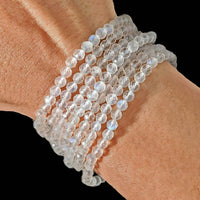 Thumbnail for Woman’s hand showcasing a faceted 4mm bracelet with white quartz beads, perfect for rewards