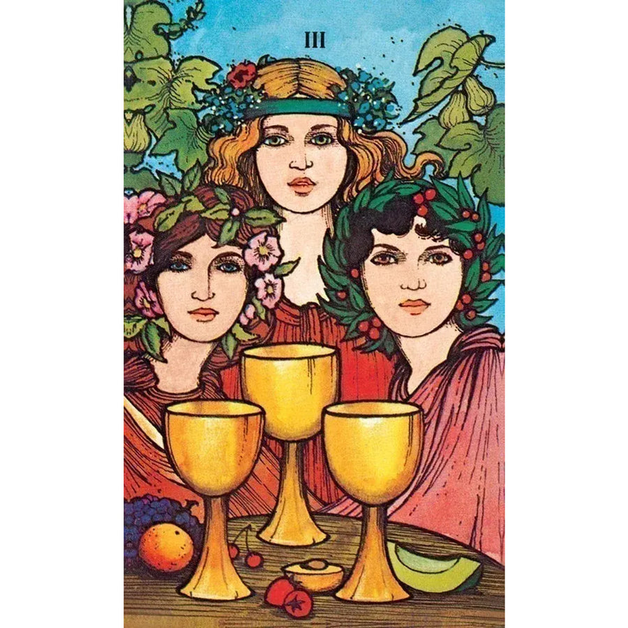 Three golden chalices on a wooden surface with Morgan-Greer Tarot in a Tin LV4404