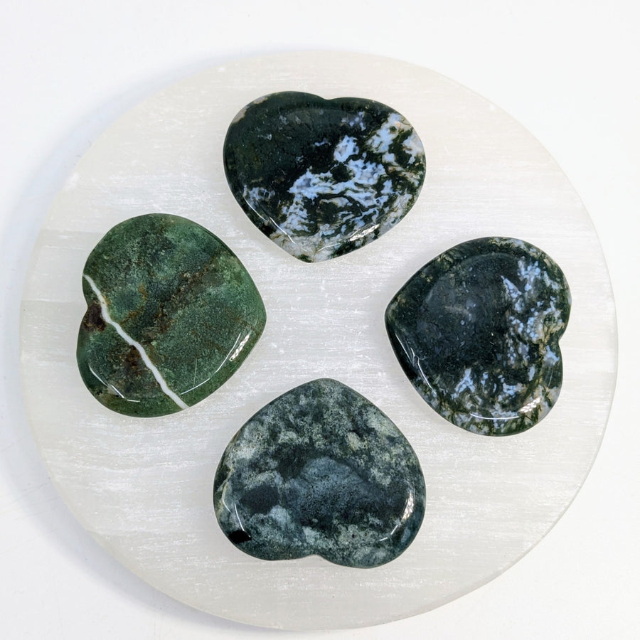 Four green moss agate heart stones displayed for the Moss Agate 1.25 Inch Thumb Heart Stone #LV7637