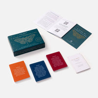 Teal rectangular storytelling game box with gold moth illustration white text from the moth presents featuring crystals