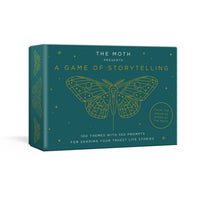 Teal storytelling game box with gold foil moth design for the moth presents featuring jewelry and crystals theme