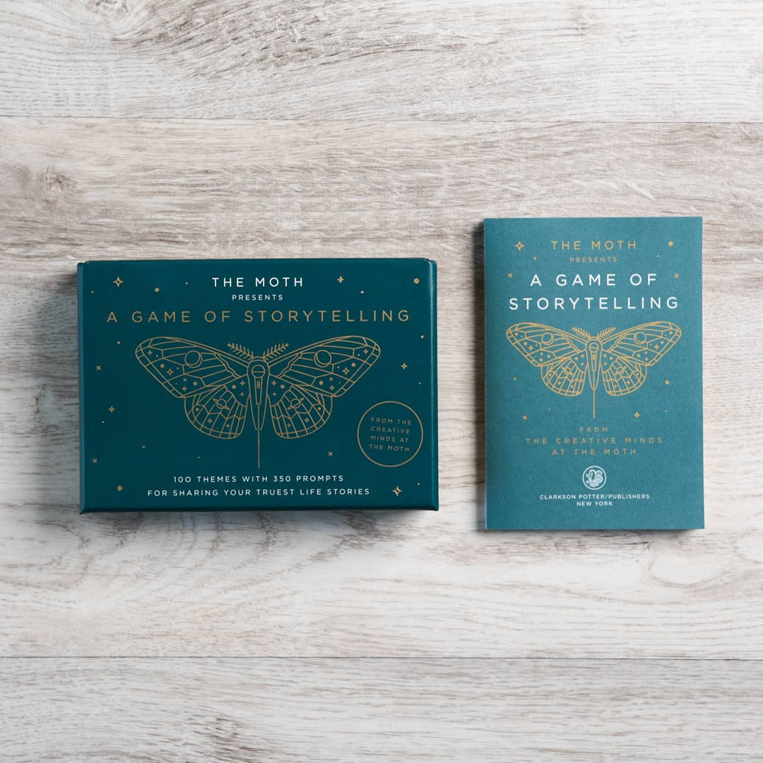 Teal rectangular storytelling game box by The Moth with gold foil moth illustration suitable for jewelry and crystals fans