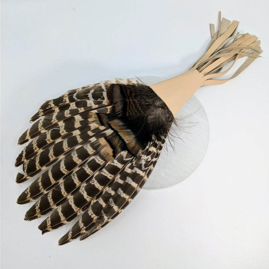 Multi-Feather Smudge Fan featuring brown and white feathers for Palo Santo rituals