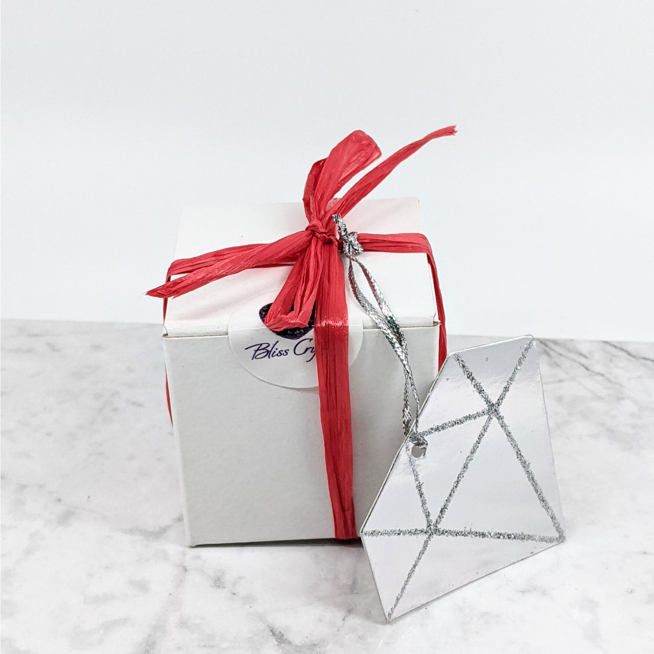 Mystery Boxes Galentines Edition #K205: white box with red ribbon and silver star