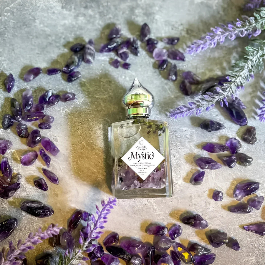 MYSTIC Lavender Natural Perfume Oil #LV3792 bottle surrounded by lavender flowers