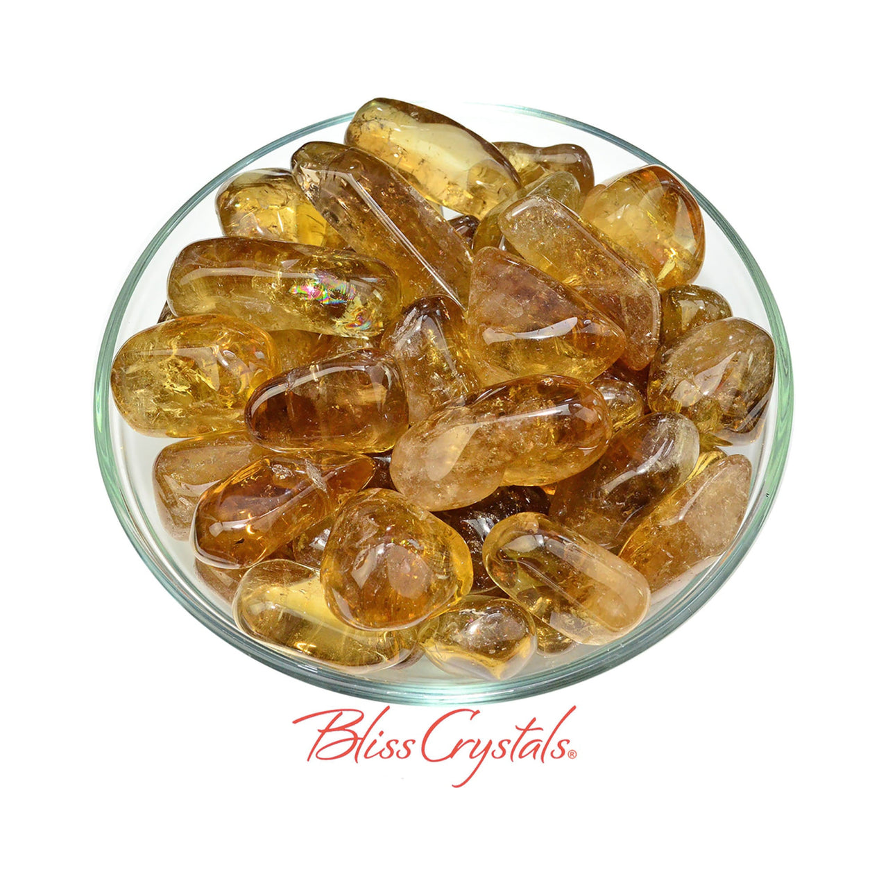 Polished Natural African Citrine Tumbled Stone in a glass dish for decor and healing