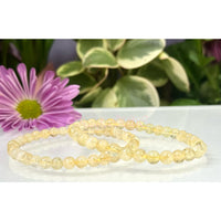 Yellow beaded bracelets made of natural citrine on a 7.5-inch crystal stretch bracelet