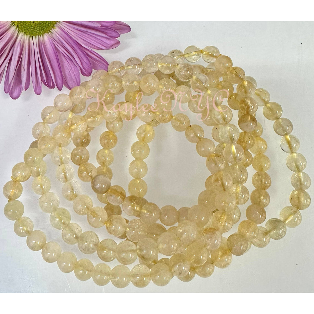 Strands of yellow Citrine gemstone beads on a Natural Citrine crystal stretch bracelet