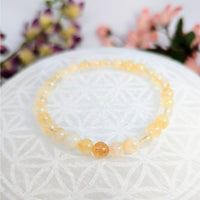 Yellow beaded bracelet made of Citrine 6mm crystals on a Stretch Bracelet design