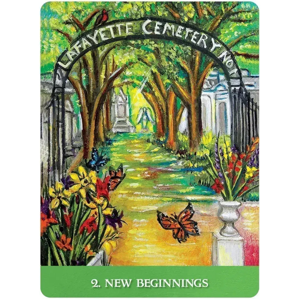 Vibrant painted New Orleans oracle deck cemetery archway with lush trees and flowers