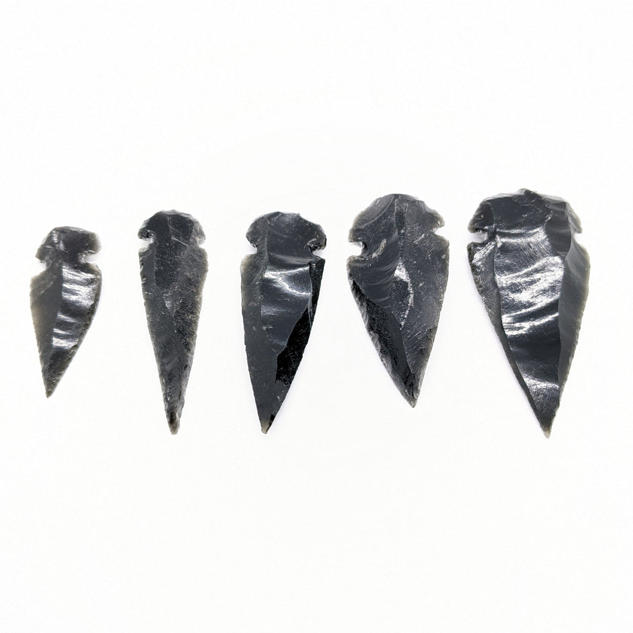 Five obsidian arrowheads in a row for Obsidian Arrowhead #C064, ideal for collectors