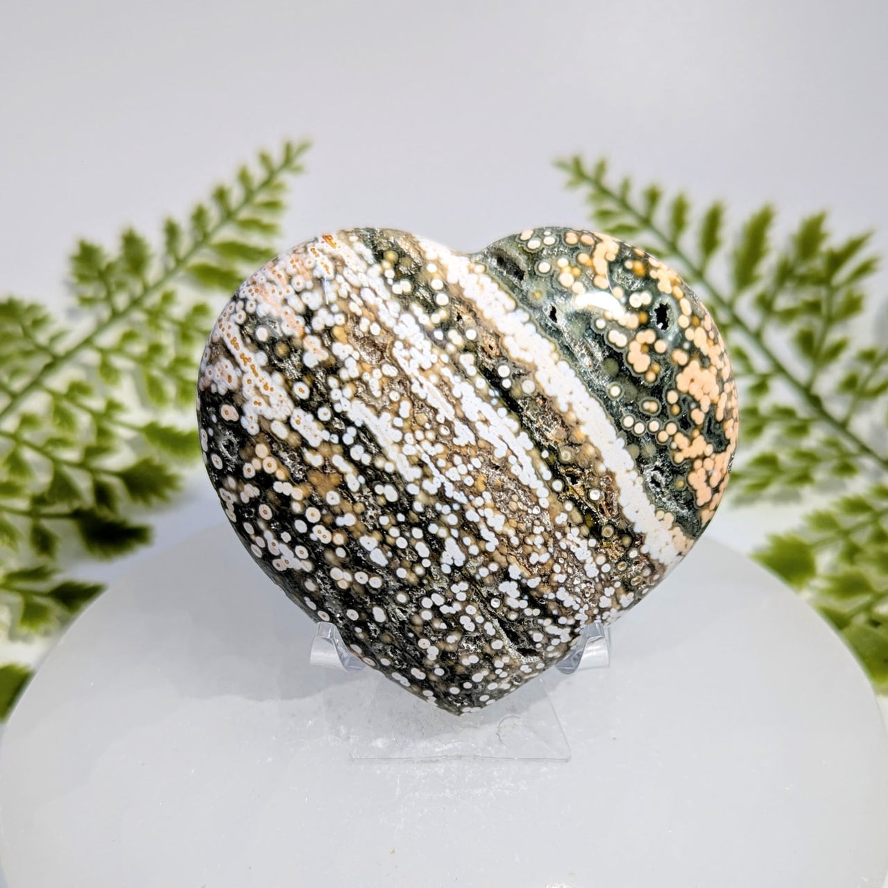 Polished 2.8-inch ocean jasper heart #BC1039 with swirling white, beige, green patterns