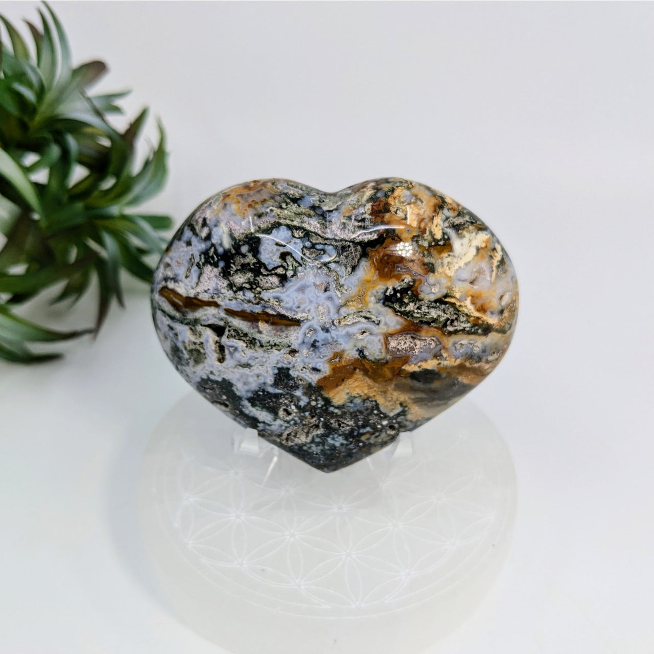 Heart-shaped Ocean Jasper stone with marbled black, white, and brown patterns