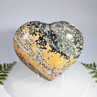 Polished ocean jasper 4 inch heart gemstone with golden speckles and glossy dark green base for jewelry and crystals