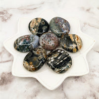 Thumbnail for A white plate showcasing Ocean Jasper Pebble stones measuring 2-2.5 inches each