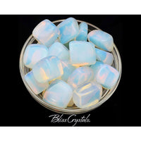 Thumbnail for Frosted glass bowl filled with white opalite tumbled stones on black background