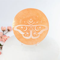 Orange Selenite Plate 3-inch with etched Moon Moth design for charging and decor