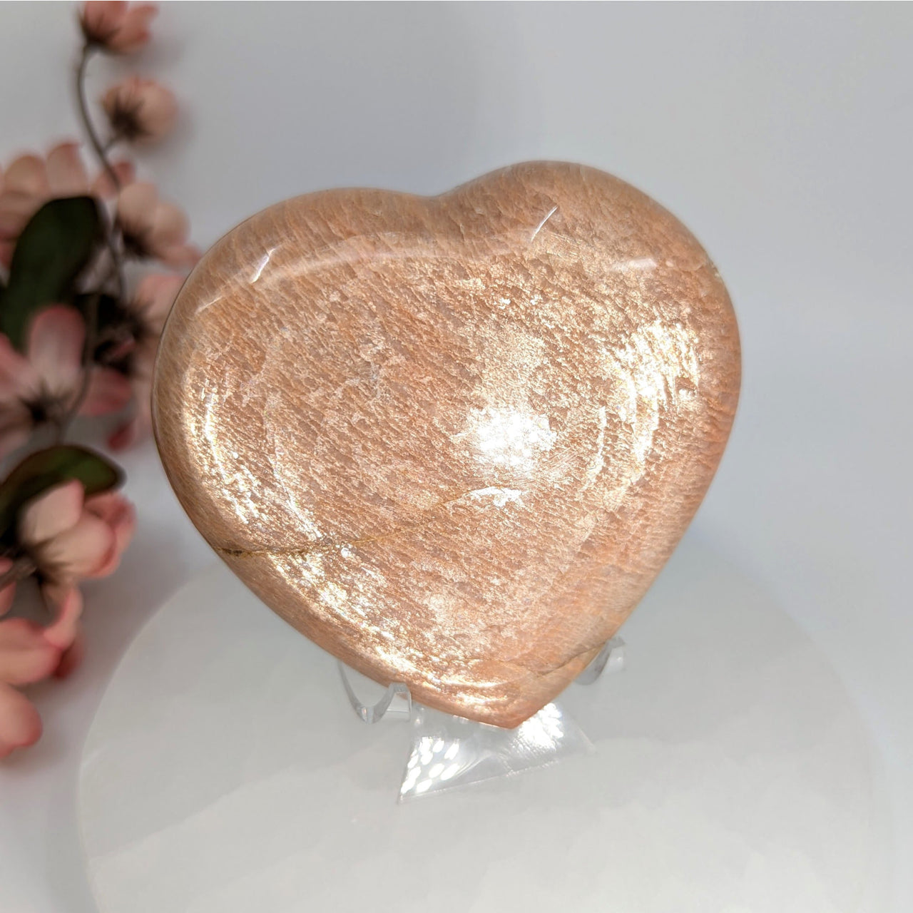 Peach-colored Heart-Shaped Peach Moonstone Stone with Stand displayed in product LV8041
