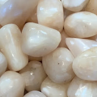 Polished white pebbles from Peach Stilbite Tumbled T024 for decorative use