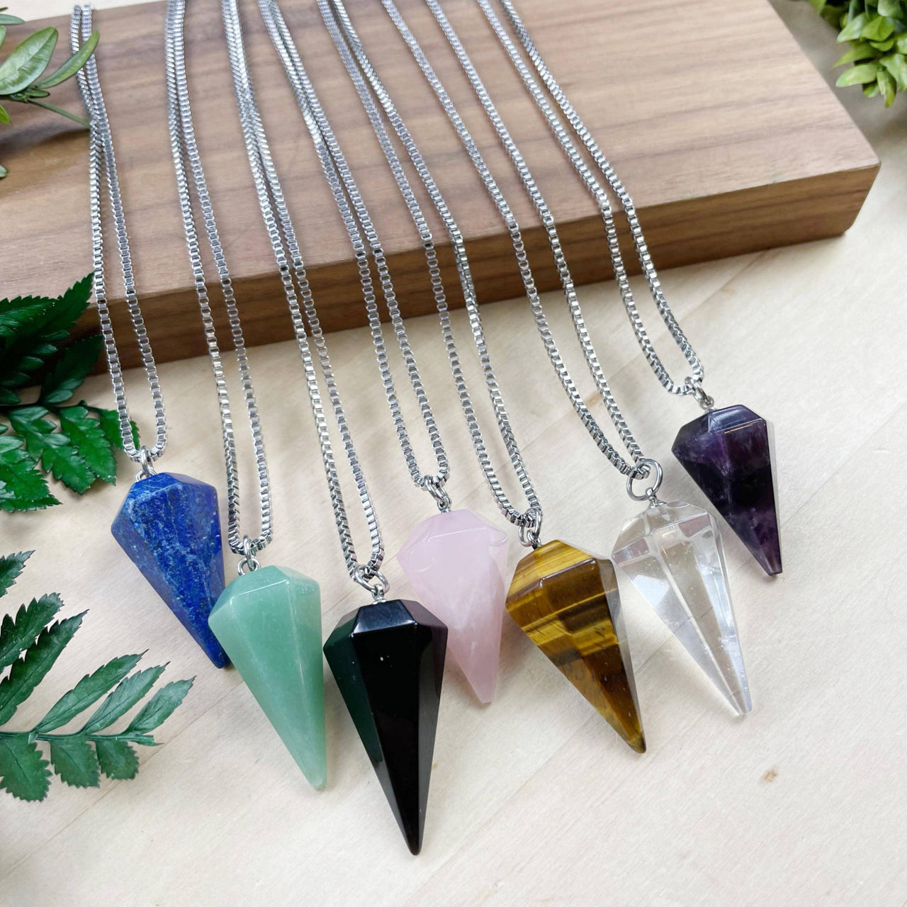 Assorted gemstone pendulum necklaces with silver chains and faceted crystals, 18 inches