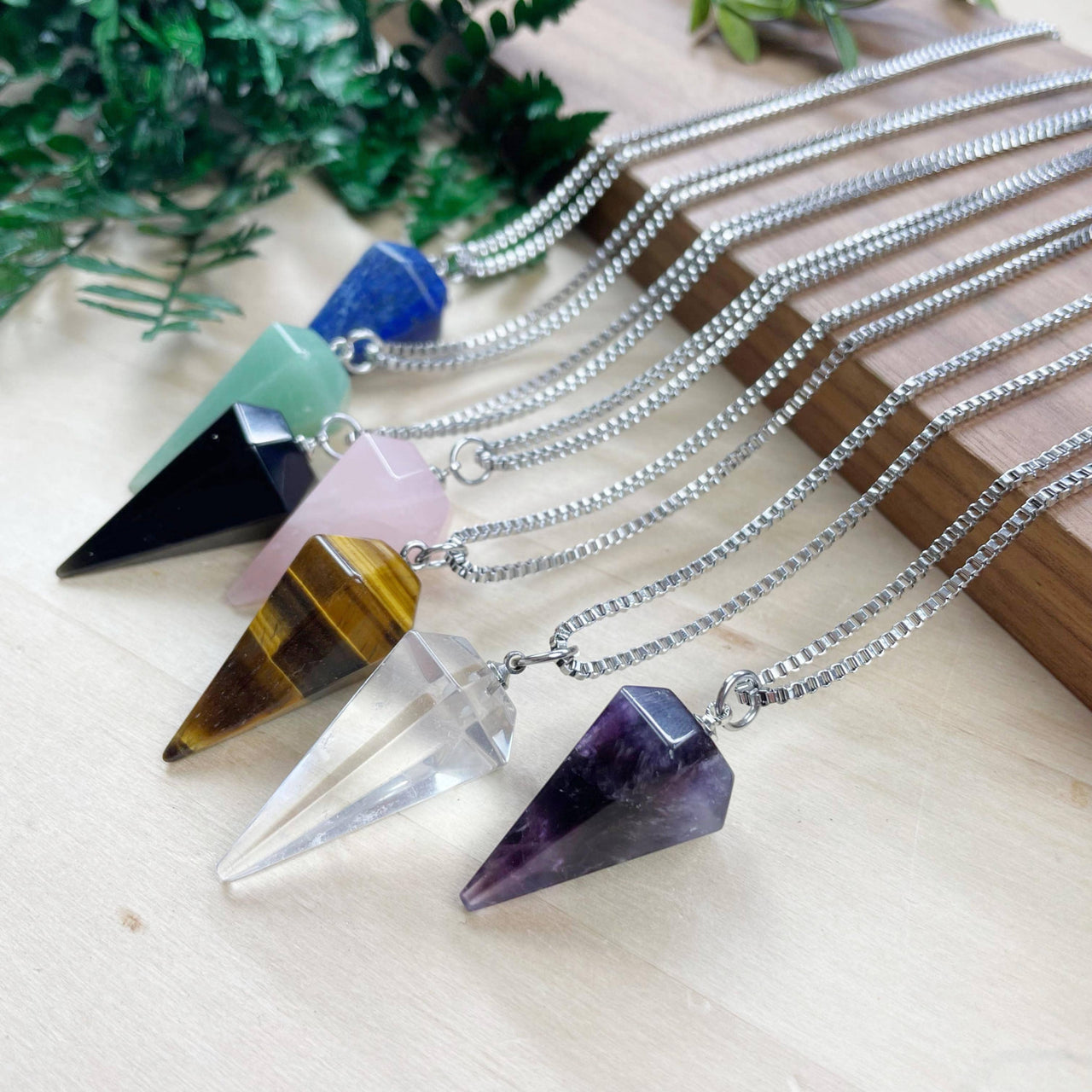 Assorted gemstone pendulum necklace with pyramid crystals on 18’’ silver chains