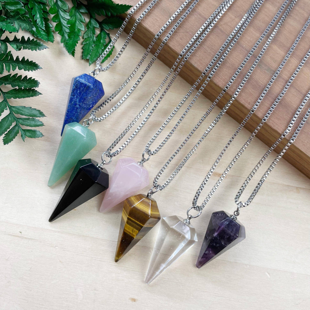 Assorted gemstone pendulum necklace with lapis, aventurine, onyx, rose quartz, tiger’s eye, quartz, amethyst