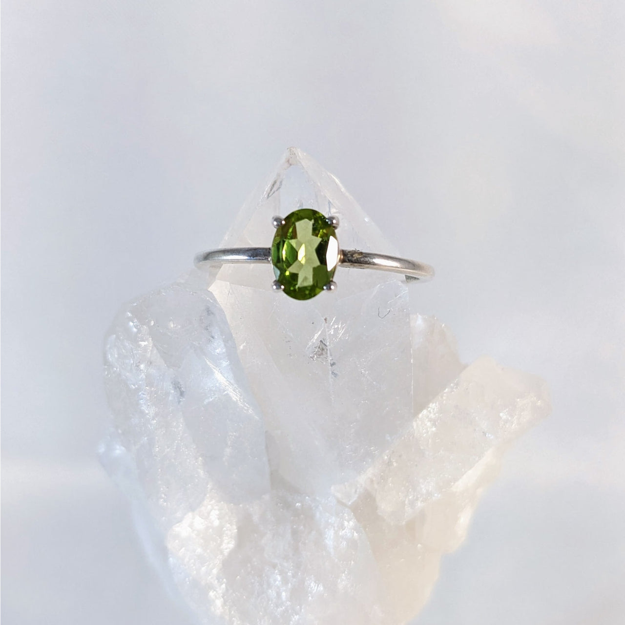 Sterling silver ring with green tourmal on rock, perfect for stacking and dainty style enthusiasts