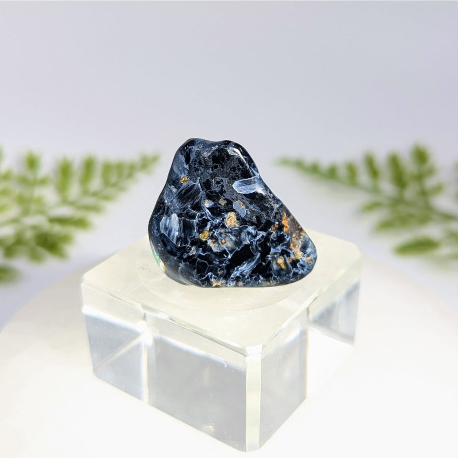 Pietersite 1.25 inch tumbled stone with dark blue black swirling white patterns and golden flecks for jewelry crystals