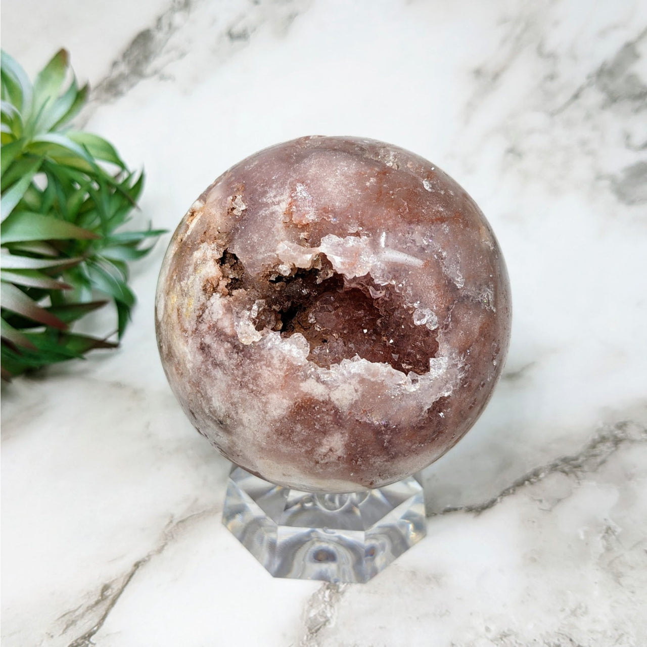 Pink Amethyst 3.1’ Sphere #LV4344 with marble globe, plant in the background