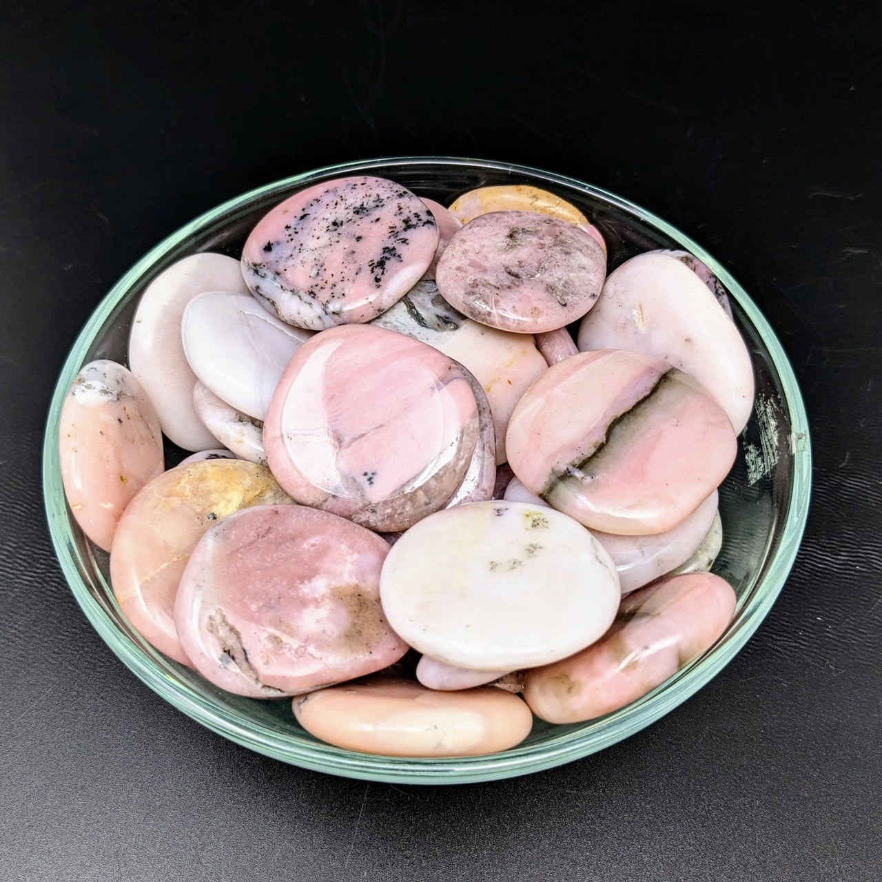 A bowl of pink opal palm stones, Pink Opal 1.4’-1.6’ Palm Stone #LV1835