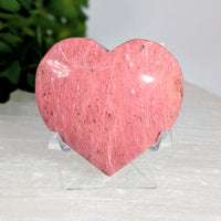 Pink petrified wood 2-inch heart #BC0632 on clear stand