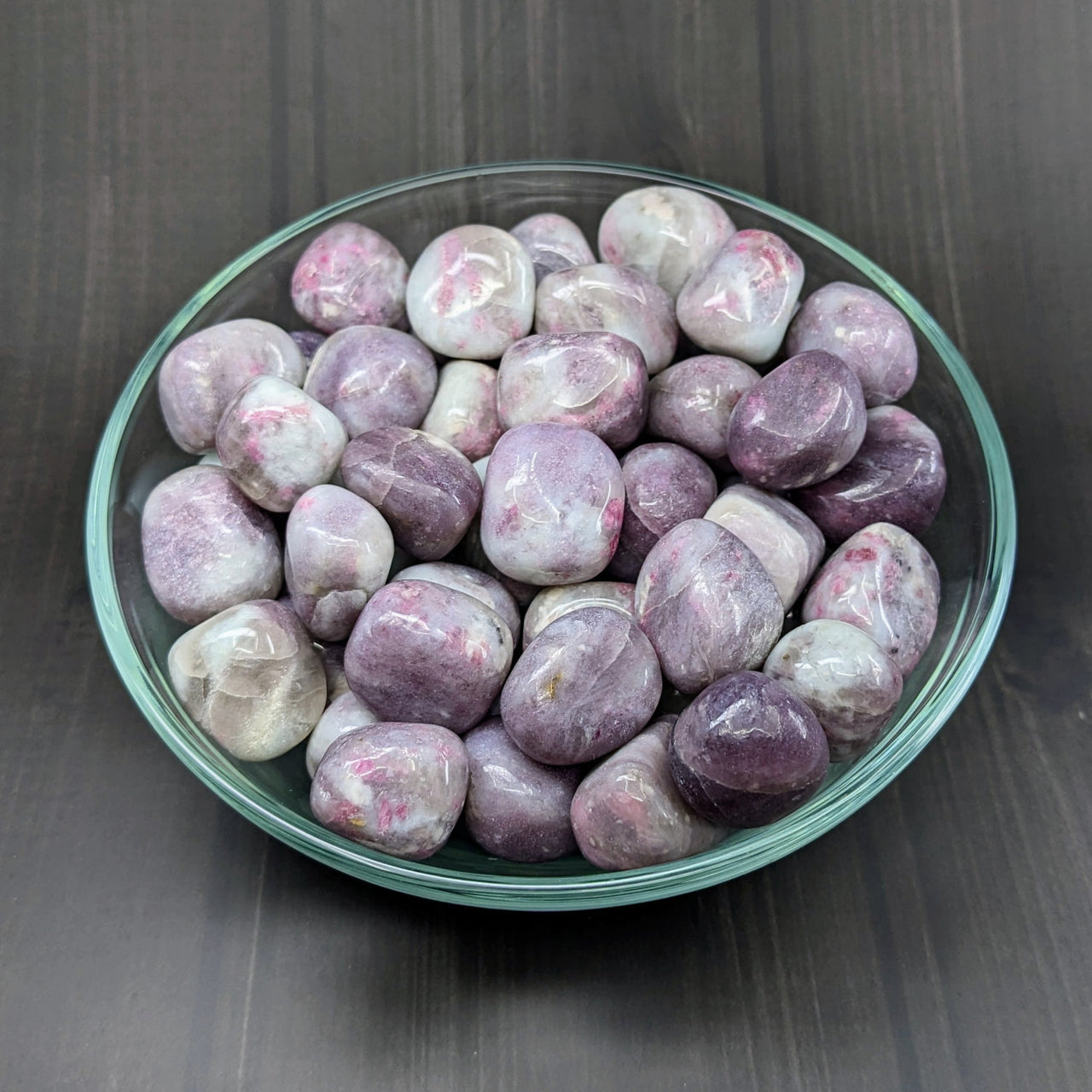 A bowl of purple marble eggs from Bliss Crystals’ Pink Tourmaline & Quartz collection