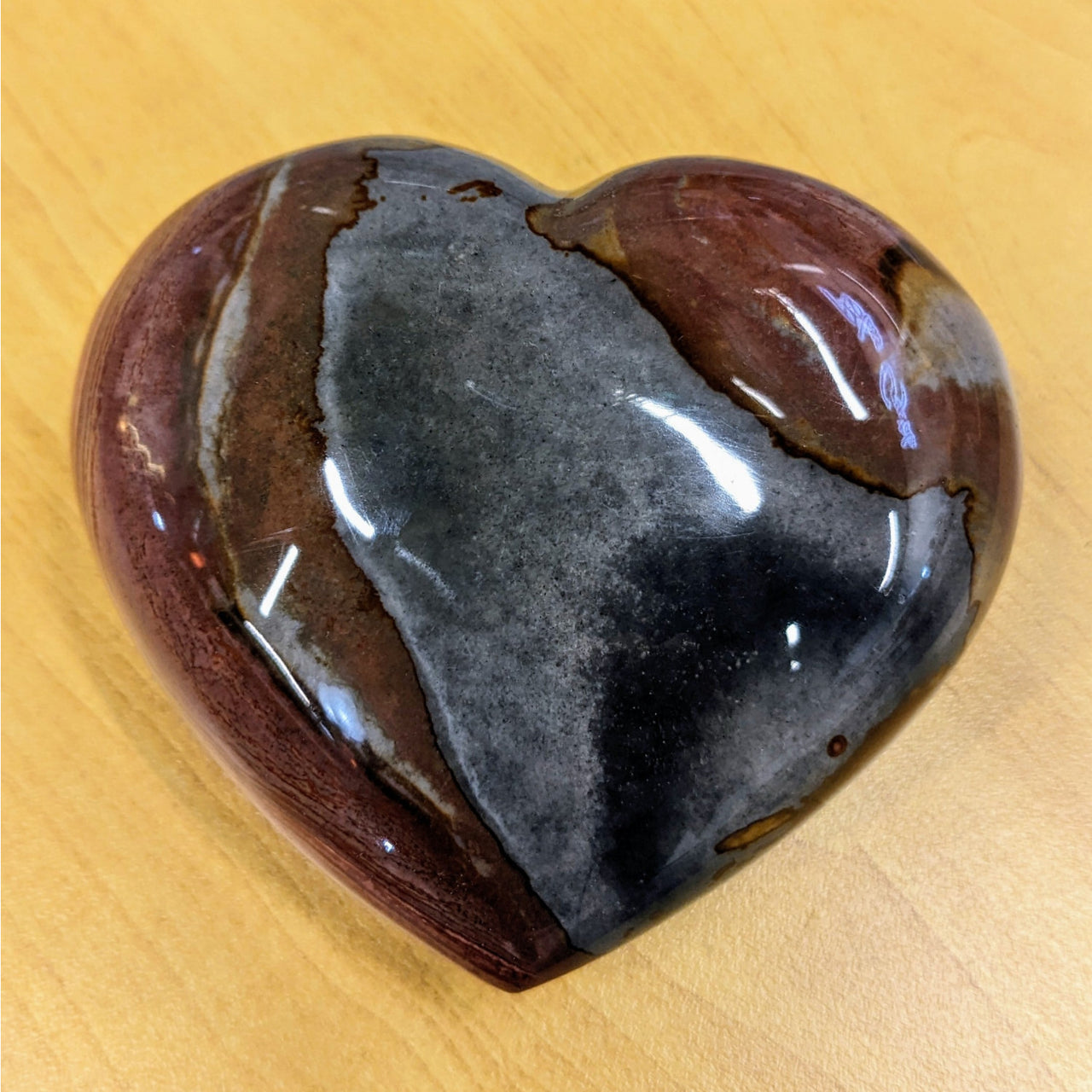 Heart-shaped Polychrome Jasper stone with dark gray and reddish-brown stripes