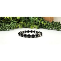Black onyx skull beaded bracelet with silver accents, 8mm, 7.5
