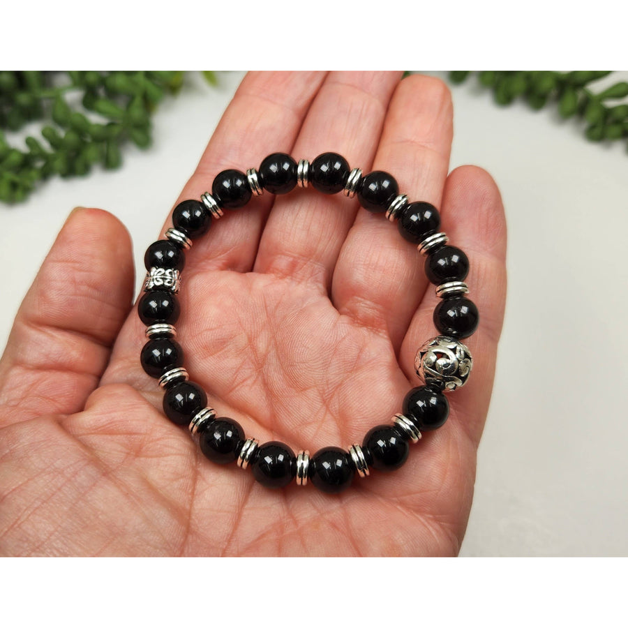 Black Tourmaline 8mm Beaded Bracelet with Silver Accents and Floral Charm