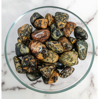 Thumbnail for Puff Adder Jasper tumbled stones in a bowl, showcasing green and yellow marble patterns