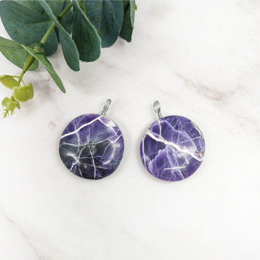Two purple opal 1.4 inch round amethyst pendant stones with natural marbled pattern and silver wire wrapped bail