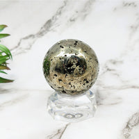 Thumbnail for Pyrite 1.9’ Sphere #LV5236 radiating positive energy on marble, plant background