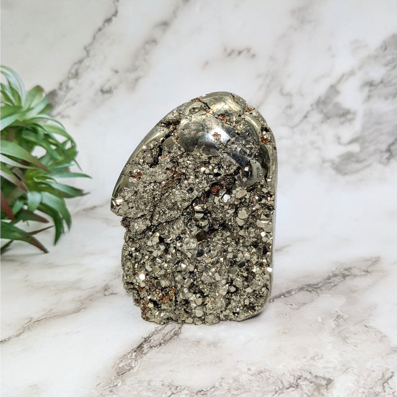 Silver stone sculpture on marble counter, Pyrite 3.2’ Freeform #LV5176